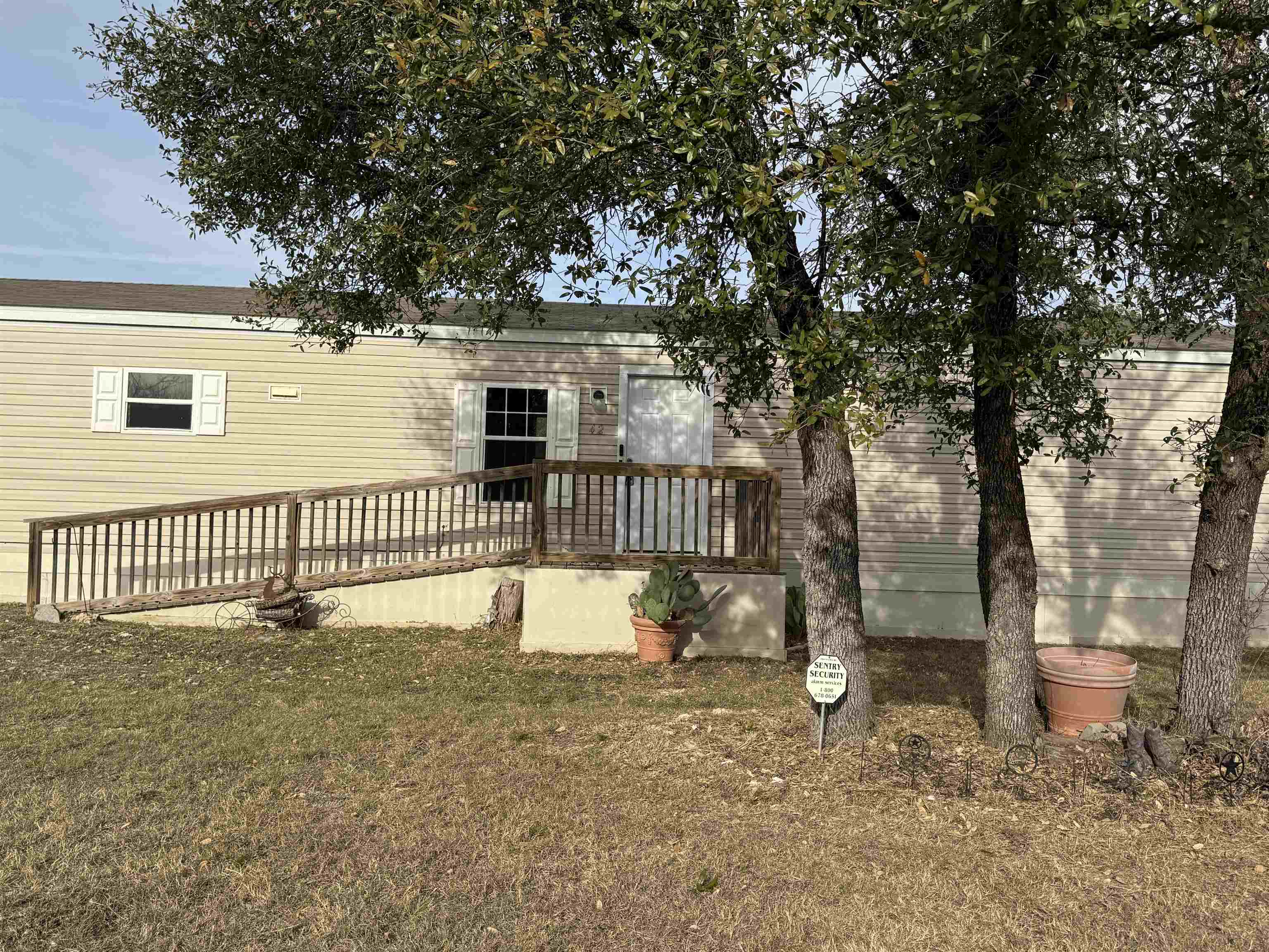 42 Reed Circle Bertram, TX 78605 - Photo 21 of 28 a front view of a house with a yard