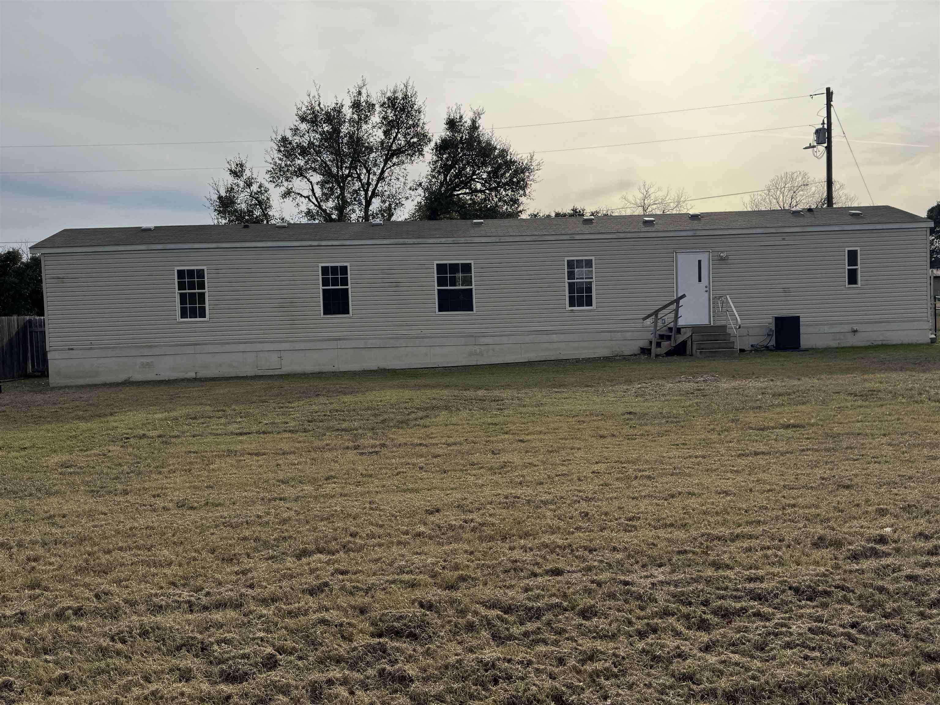 42 Reed Circle Bertram, TX 78605 - Photo 22 of 28 a view of a house with a backyard