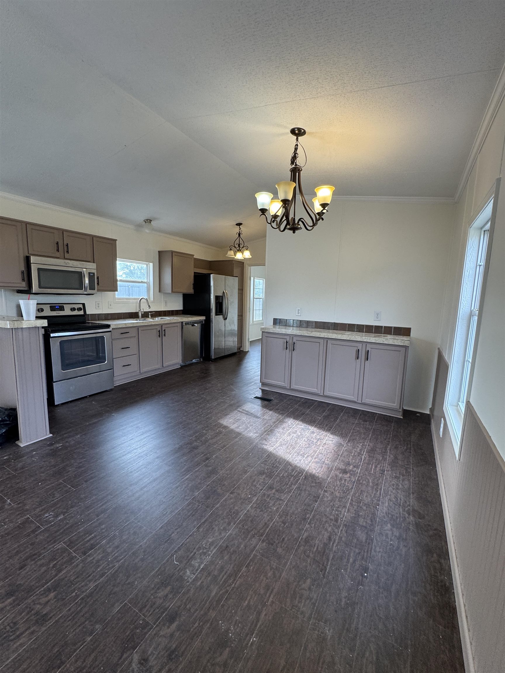 42 Reed Circle Bertram, TX 78605 - Photo 4 of 28 a living room with stainless steel appliances furniture and wooden floor