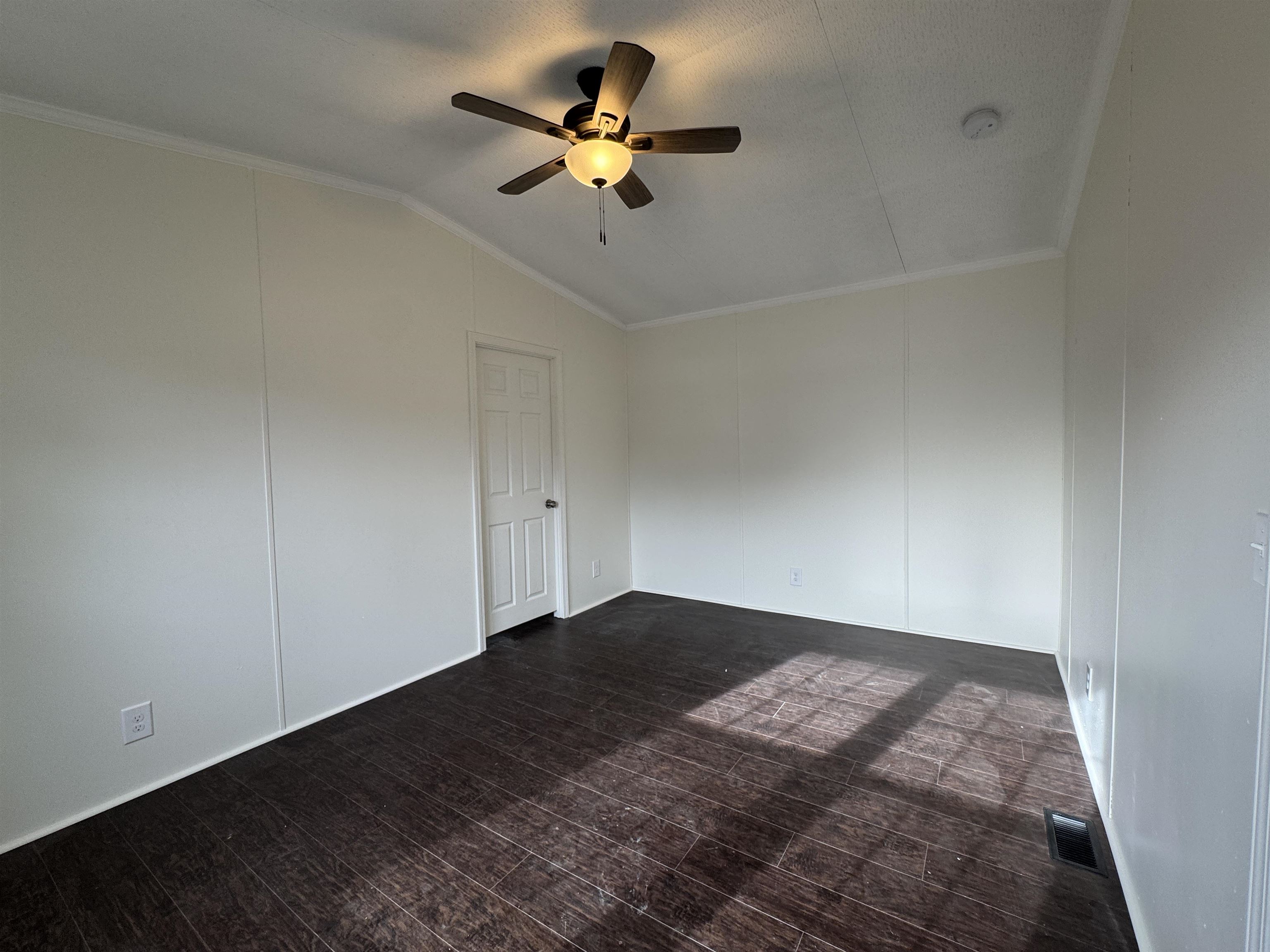 42 Reed Circle Bertram, TX 78605 - Photo 6 of 28 wooden floor in an empty room with a window