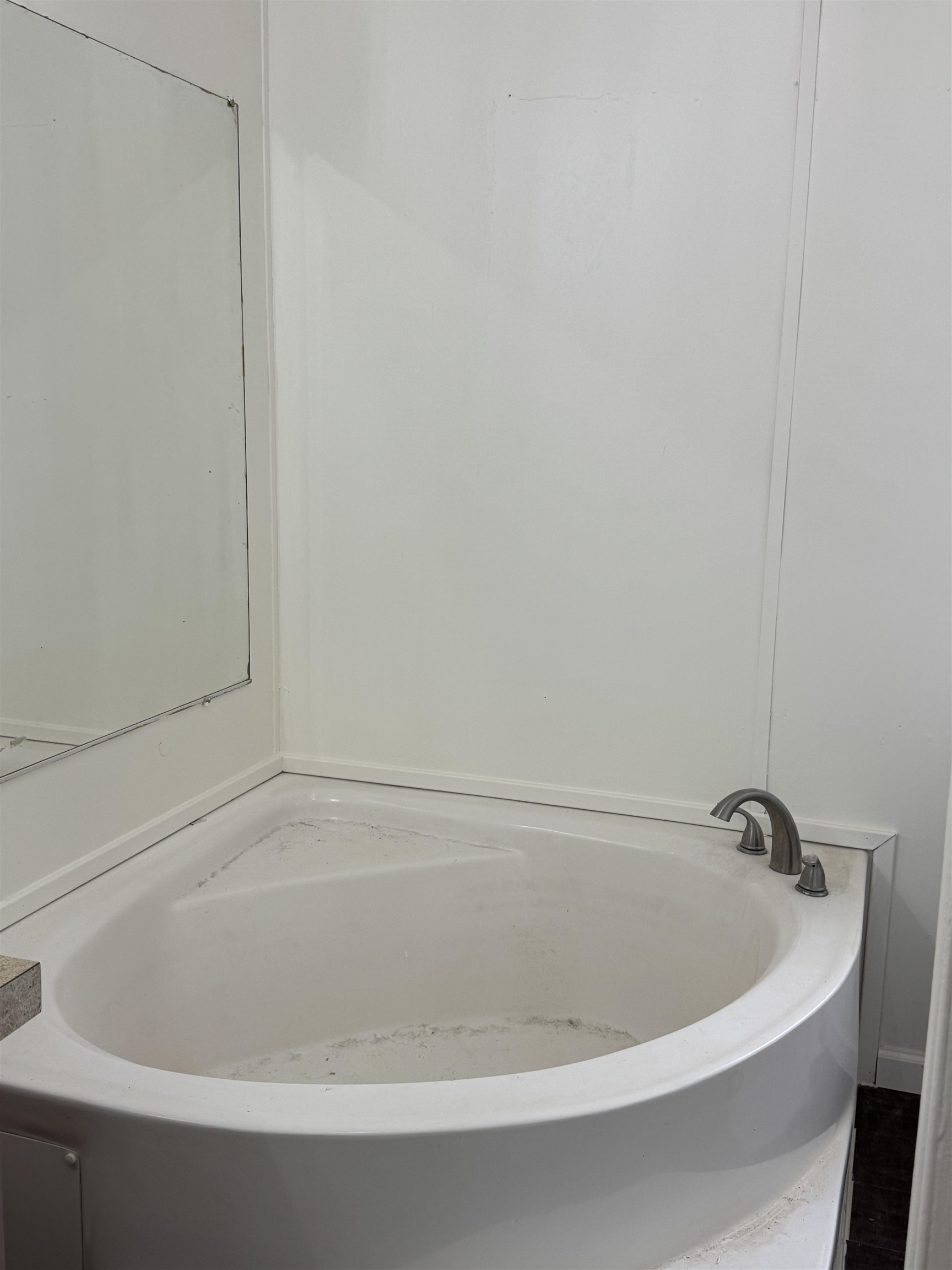 42 Reed Circle Bertram, TX 78605 - Photo 9 of 28 a white bath tub sitting in a bathroom