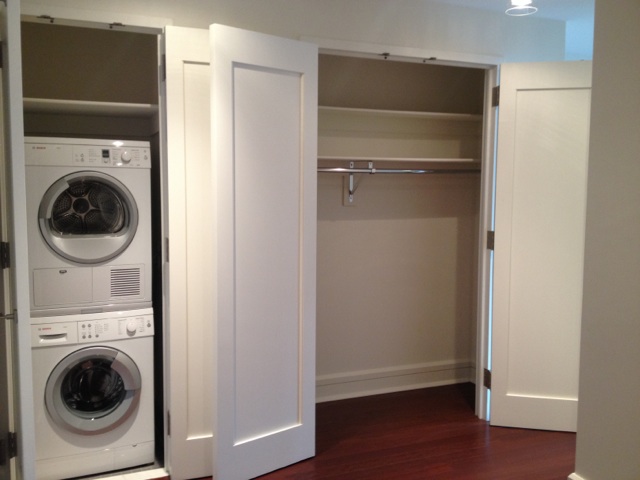 60 Riverside Boulevard, Unit 1016 Manhattan, NY 10069 - Photo 12 of 14 a room with a washer and dryer