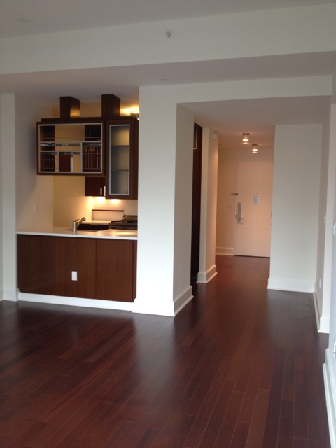 60 Riverside Boulevard, Unit 1016 Manhattan, NY 10069 - Photo 2 of 14 a view of kitchen with wooden floor and window