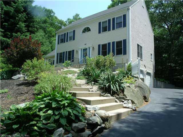 60 Fishing Brook Road Westbrook, CT 06498 - Photo 1 of 1 a front view of a house with a yard