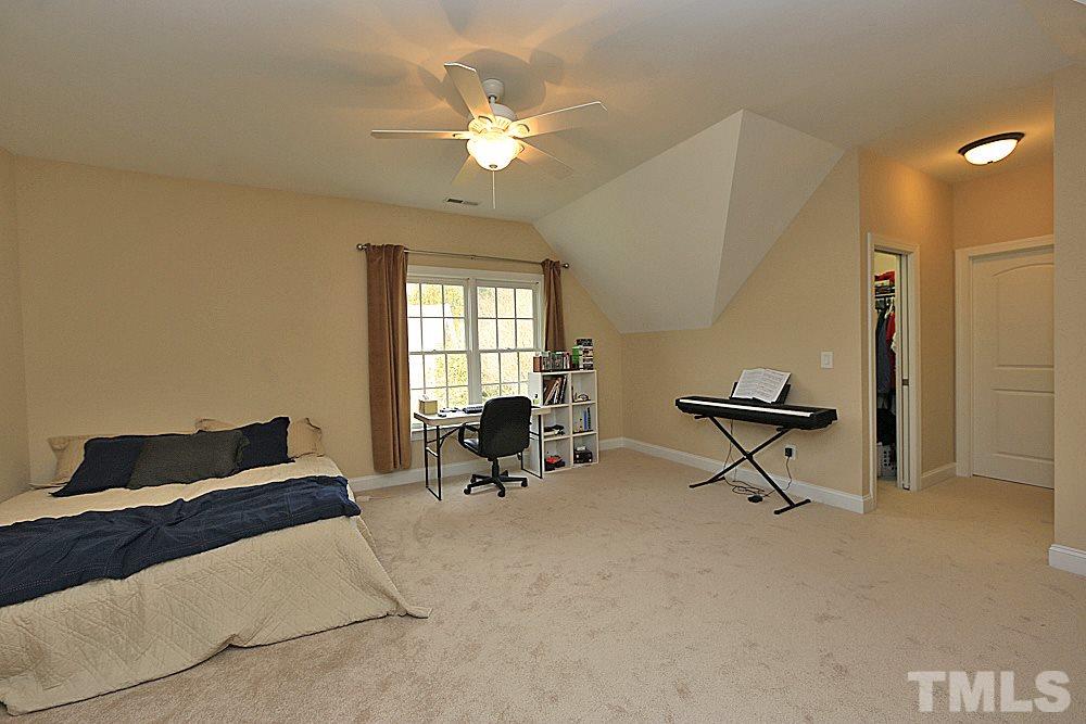 103 Duckhead Point Cary, NC 27518 - Photo 14 of 25 a living room with furniture and a chandelier