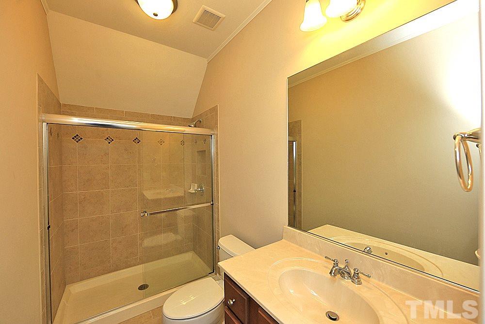 103 Duckhead Point Cary, NC 27518 - Photo 20 of 25 a bathroom with a sink toilet and shower