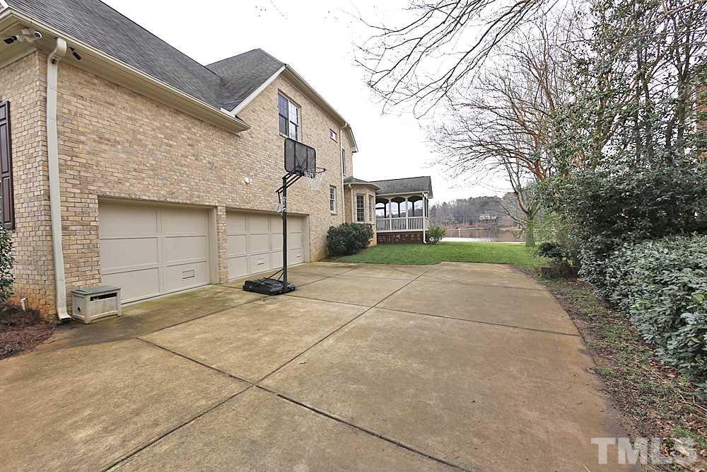 103 Duckhead Point Cary, NC 27518 - Photo 25 of 25 a view of a house with a yard and garage