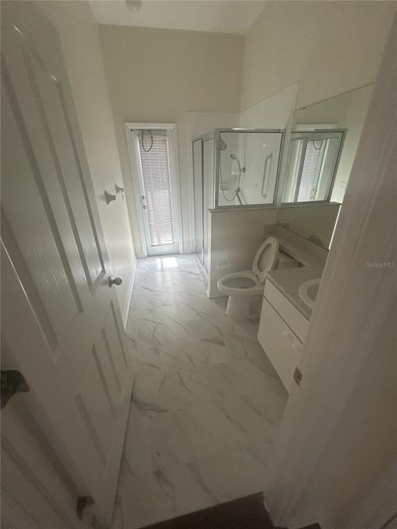 1332 Hatcher Loop Drive Brandon, FL 33511 - Photo 26 of 35 a bathroom with a sink and mirror