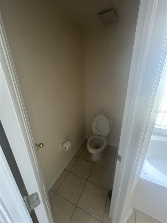 1332 Hatcher Loop Drive Brandon, FL 33511 - Photo 30 of 35 a bathroom with a granite countertop sink and toilet