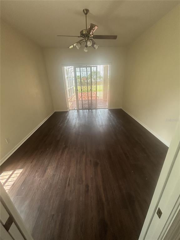 1332 Hatcher Loop Drive Brandon, FL 33511 - Photo 6 of 35 an empty room with wooden floor and windows