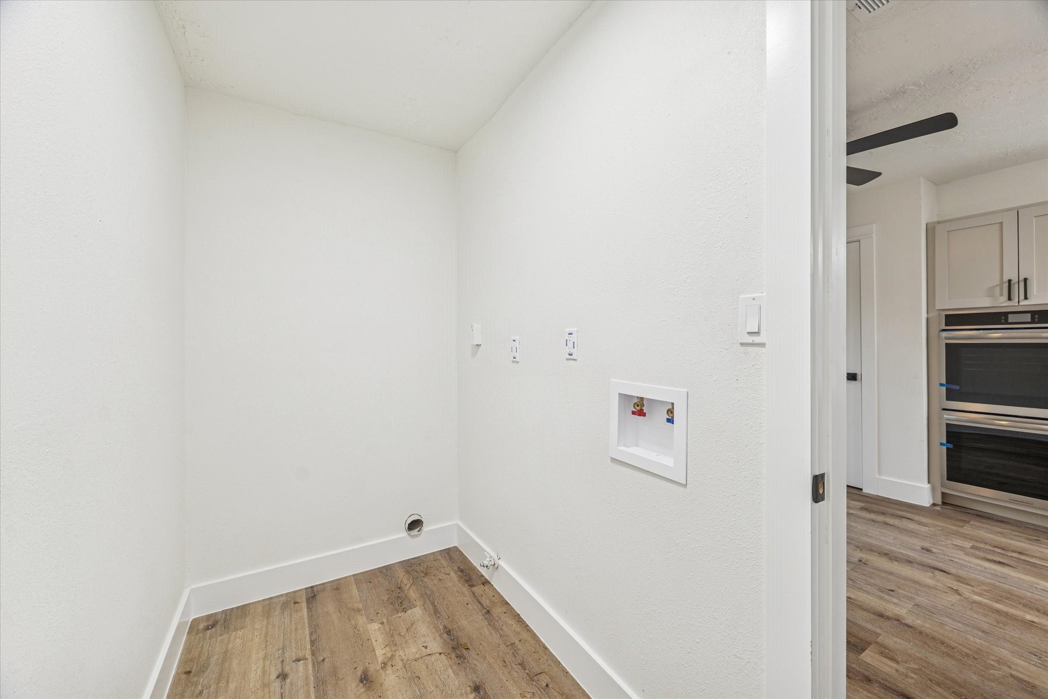 3623 Acorn Way Lane Spring, TX 77389 - Photo 20 of 25 a view of storage and utility room with wooden floor
