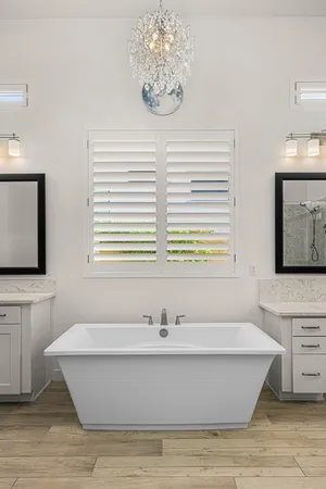 a bathroom with a bathtub and a sink