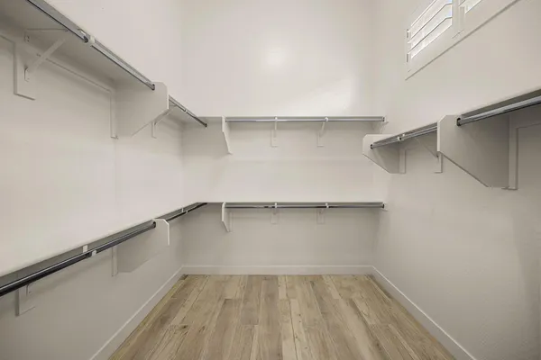a view of an empty walk in closet