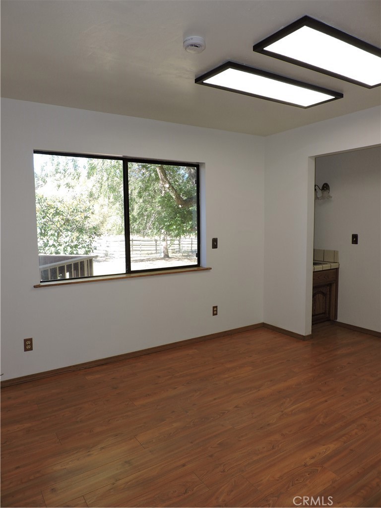 26931 Columbia Way Tehachapi, CA 93561 - Photo 39 of 49 First Bedroom last used as an office. New Interior paint, wood flooring. Wonderful view of the back pasture.