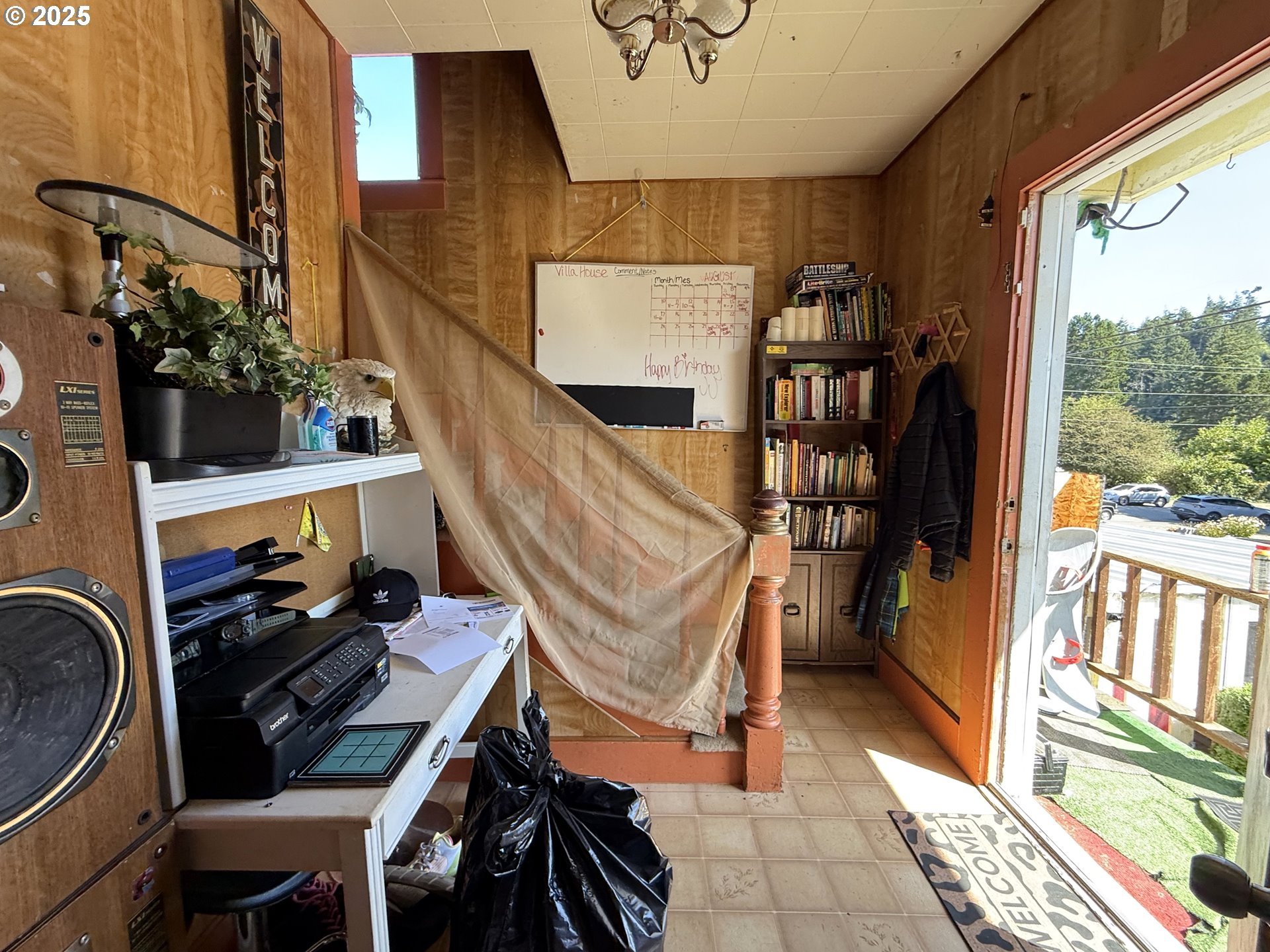 173 North 11th Street Coos Bay, OR 97420 - Photo 3 of 9 a view of an entryway with wooden floor and windows