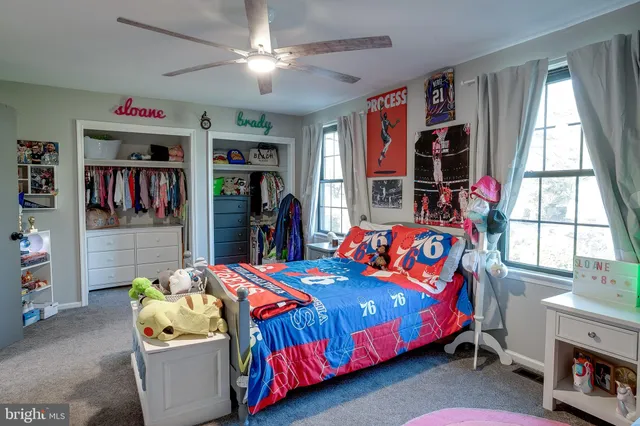 a bedroom with a bed furniture and a window