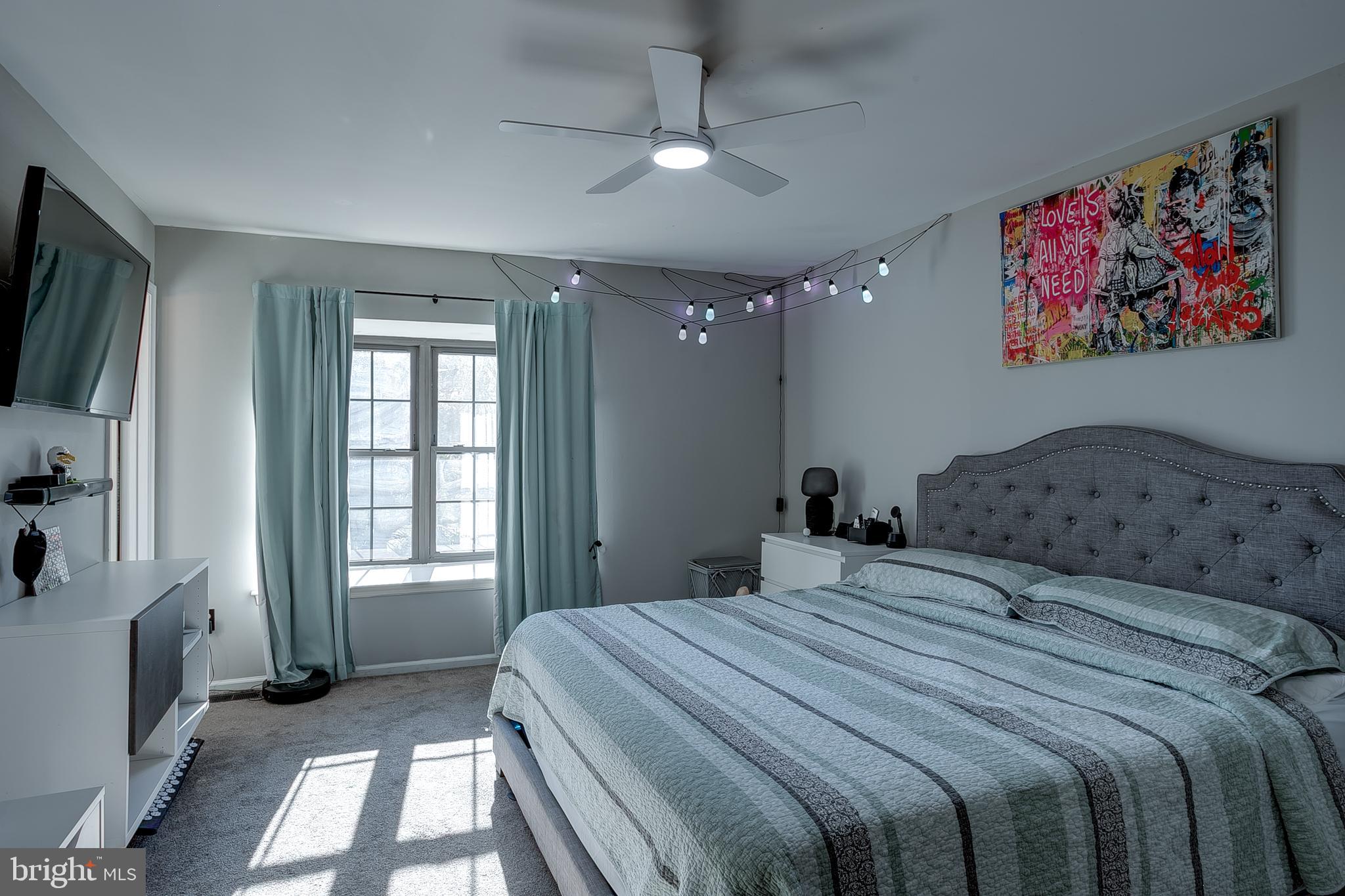 3 Crofton Commons Cherry Hill, NJ 08034 - Photo 15 of 24 a bedroom with a balcony a bed and a flat screen tv