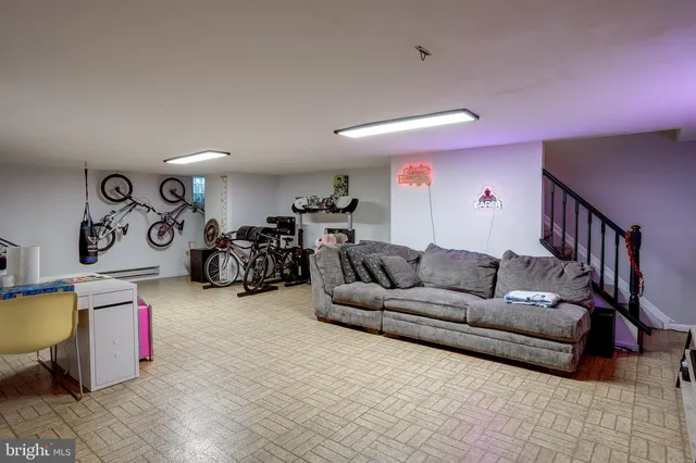 a living room with furniture a couch and a window