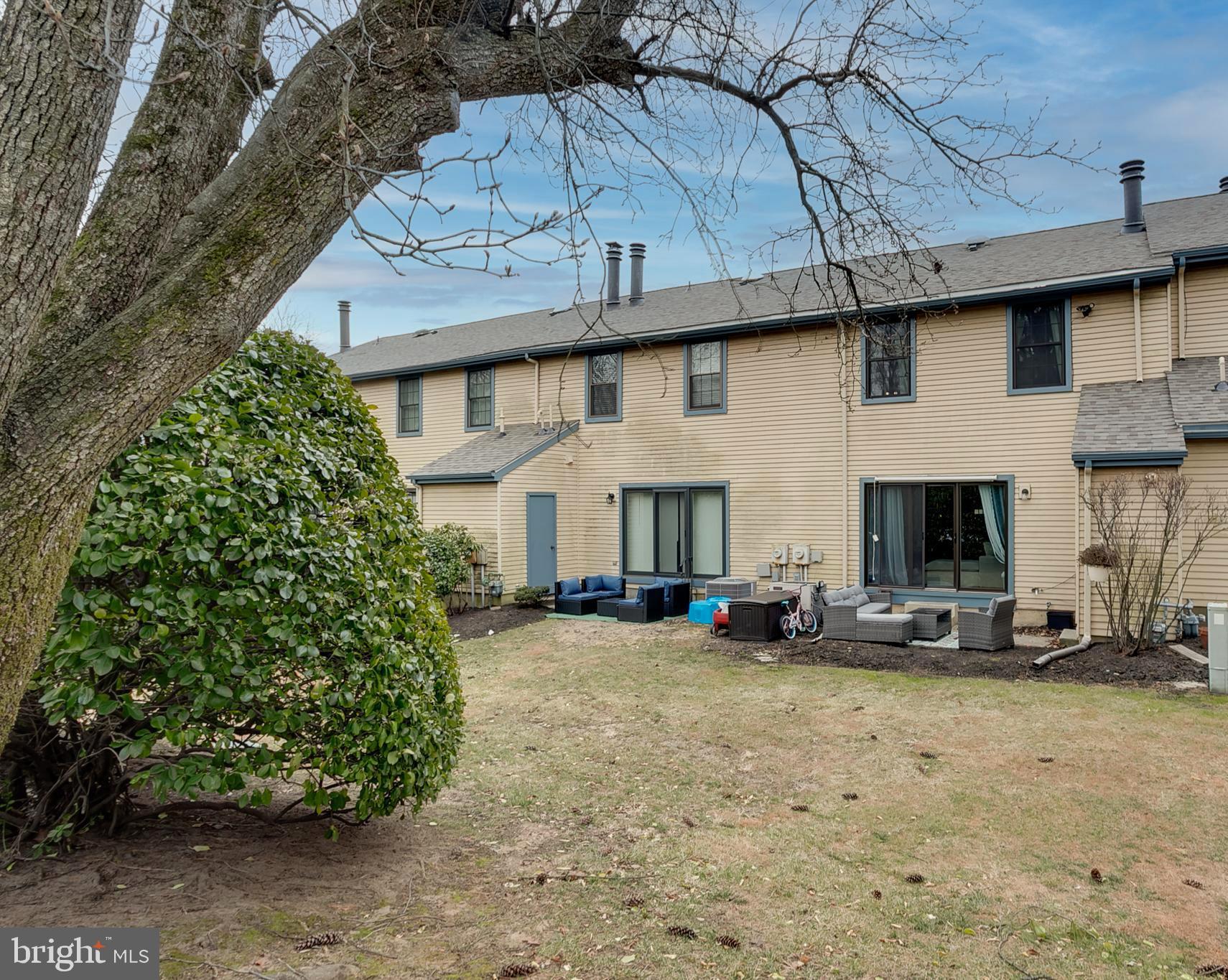 3 Crofton Commons Cherry Hill, NJ 08034 - Photo 22 of 24 a view of a white house with large trees and windows