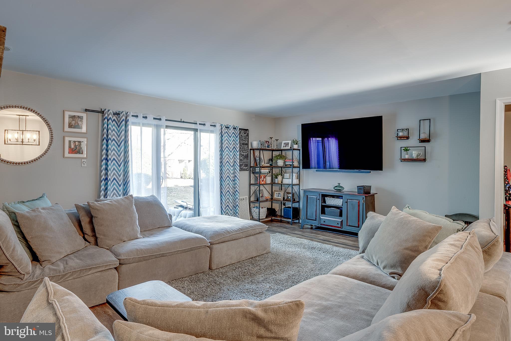 3 Crofton Commons Cherry Hill, NJ 08034 - Photo 4 of 24 a living room with furniture and a flat screen tv