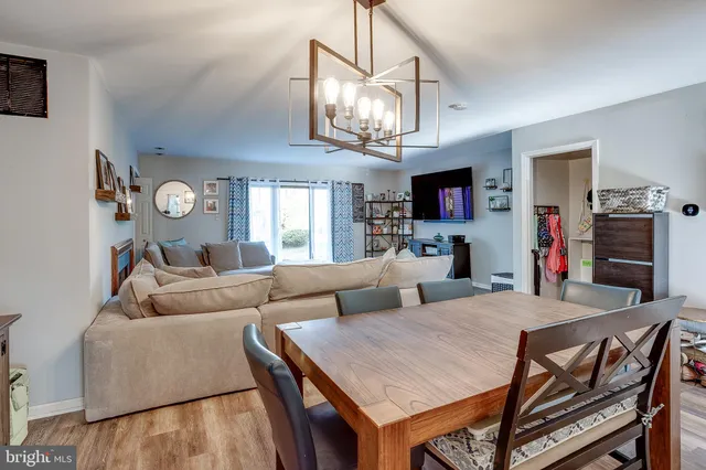 a living room with fireplace furniture and a flat screen tv