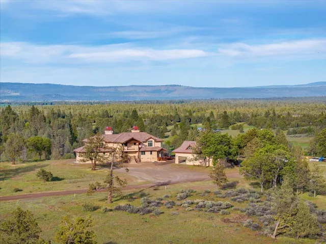 a view of balcony with wooden floor and outdoor seating