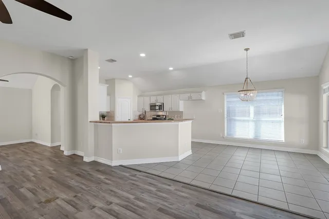 a view of kitchen with cabinets and wooden floor