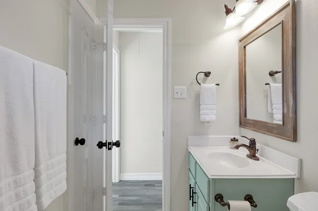 a bathroom with a sink and mirror