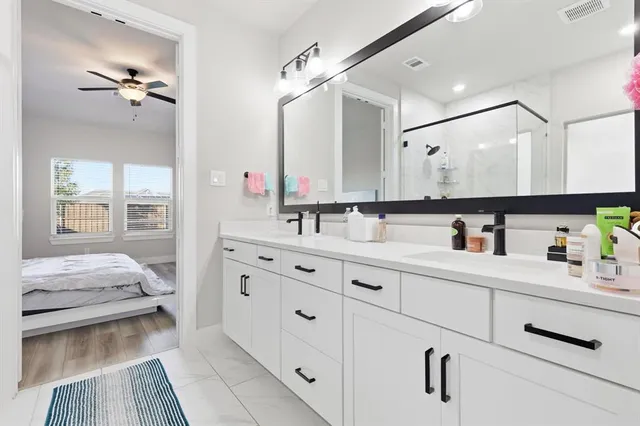 a bathroom with a bathtub and a shower