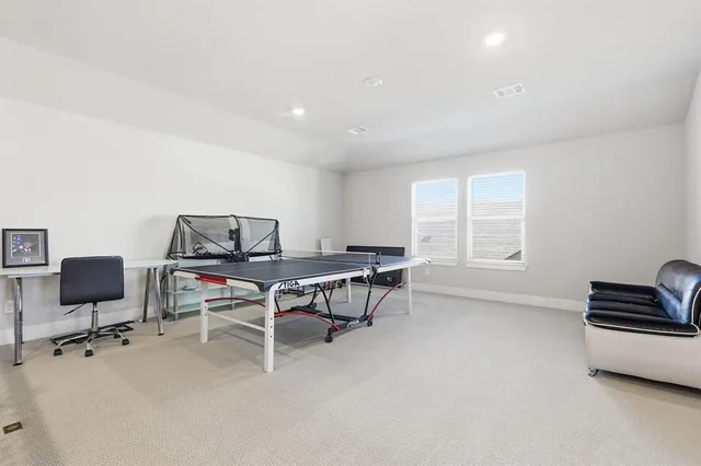 a workspace with furniture and window