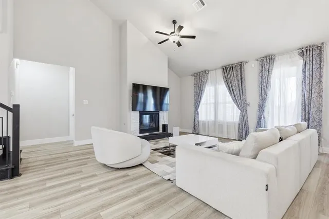 a living room with furniture and a window