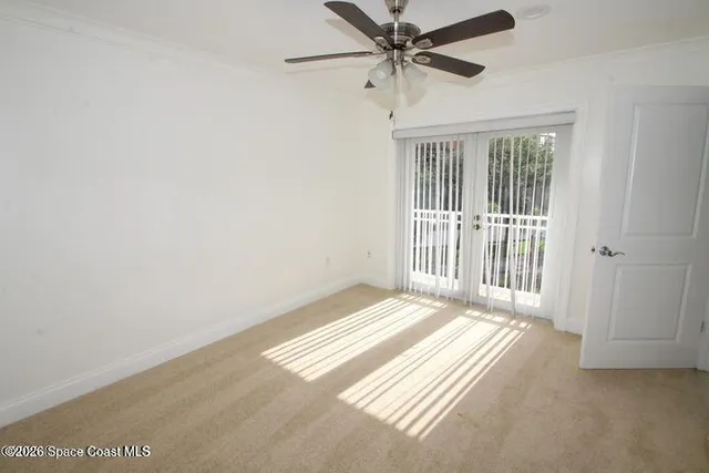 a view of a livingroom with a ceiling fan