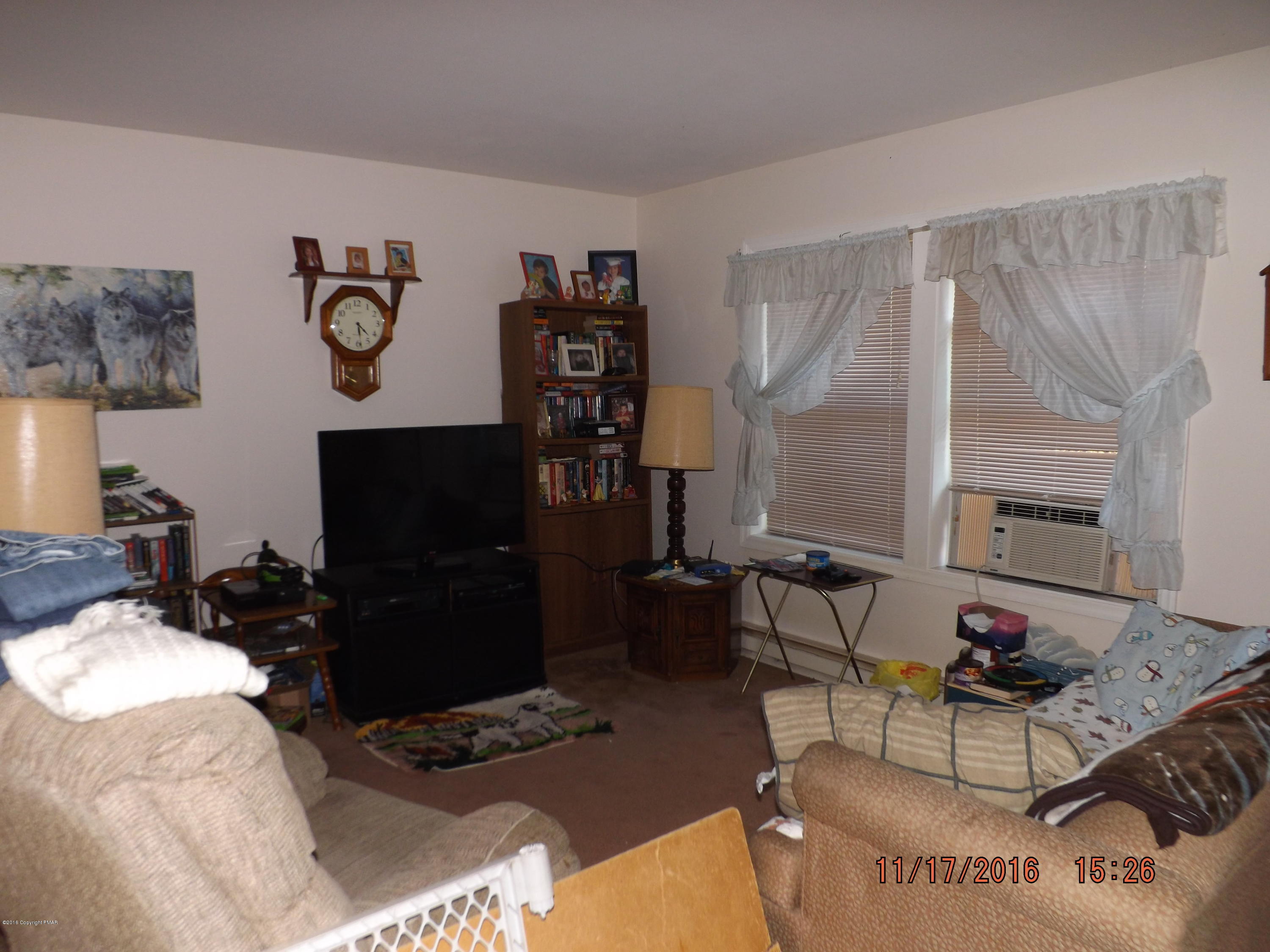 3259 Spruce Cabin Road Cresco, PA 18326 - Photo 6 of 14 a living room with furniture and a flat screen tv