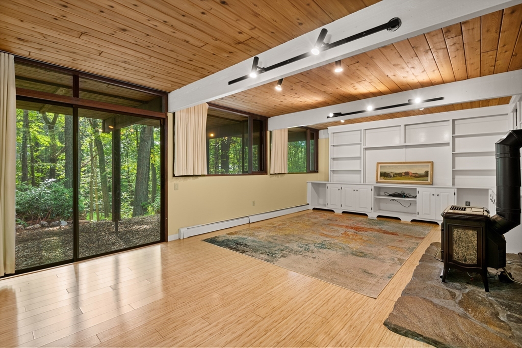 4 Plum Hill Manchester, MA 01944 - Photo 24 of 39 a view of a livingroom with furniture wooden floor and a window