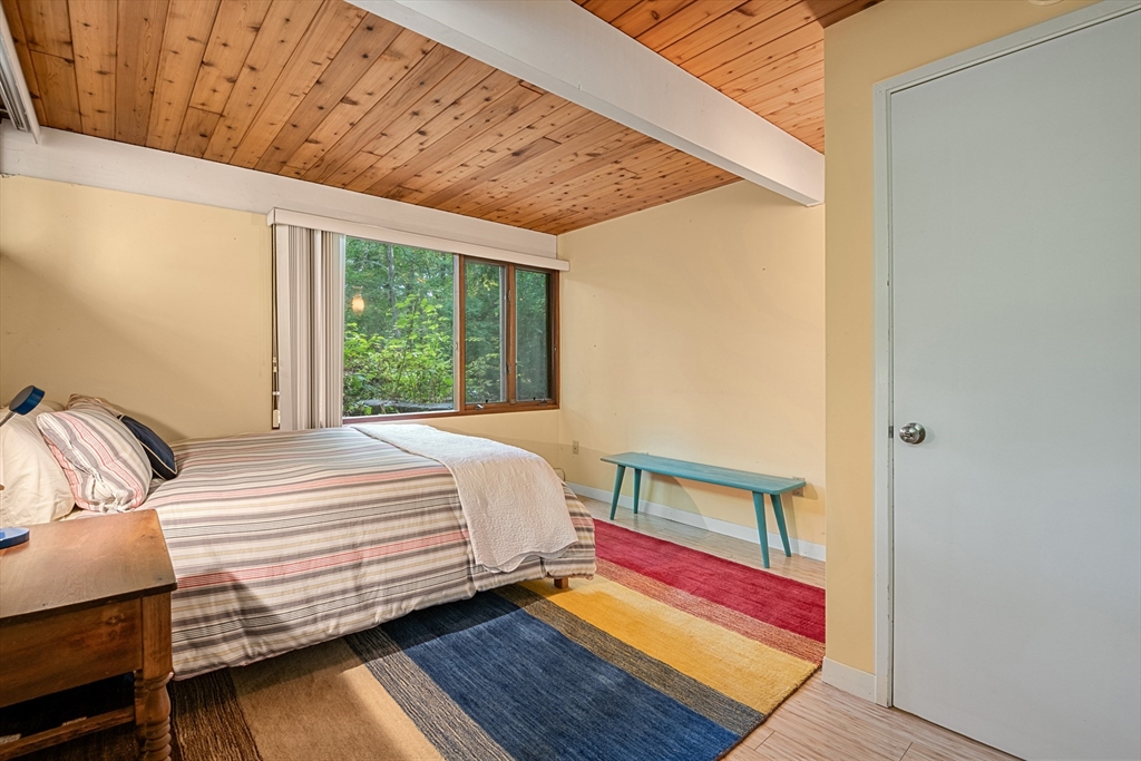 4 Plum Hill Manchester, MA 01944 - Photo 27 of 39 a bedroom with a bed and wooden floor
