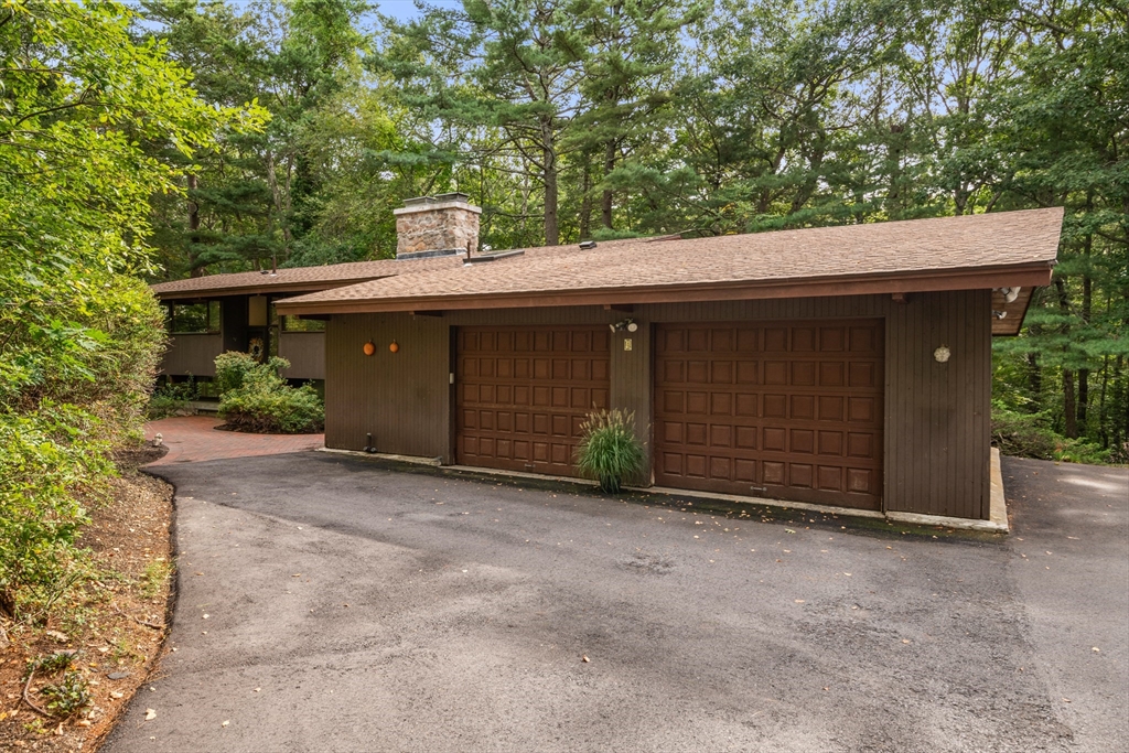 4 Plum Hill Manchester, MA 01944 - Photo 31 of 39 a front view of a house with a yard and garage