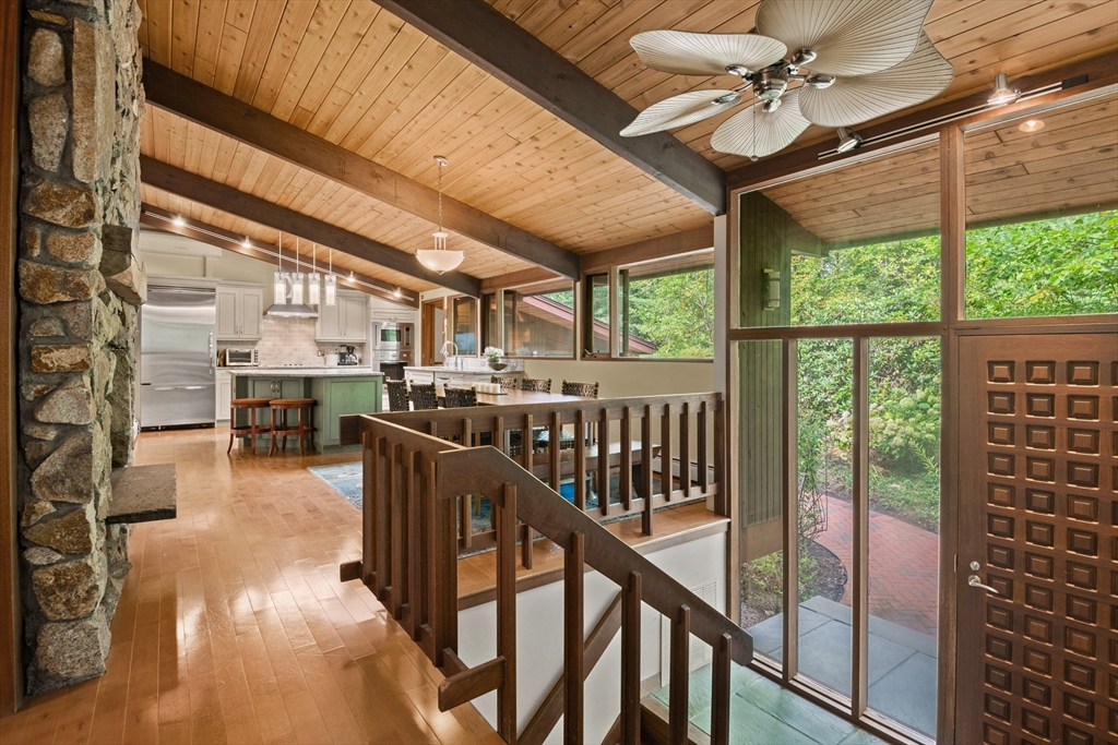 4 Plum Hill Manchester, MA 01944 - Photo 4 of 39 a view of a porch with furniture and a ceiling fan