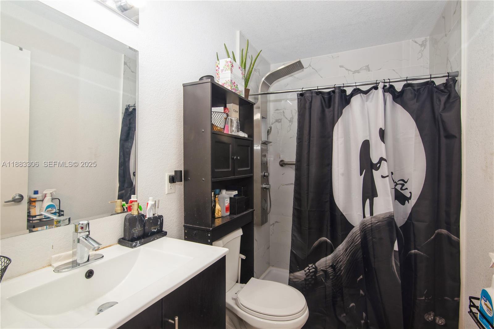 14366 Southwest 258th Lane Homestead, FL 33032 - Photo 20 of 24 a bathroom with a sink toilet and shower