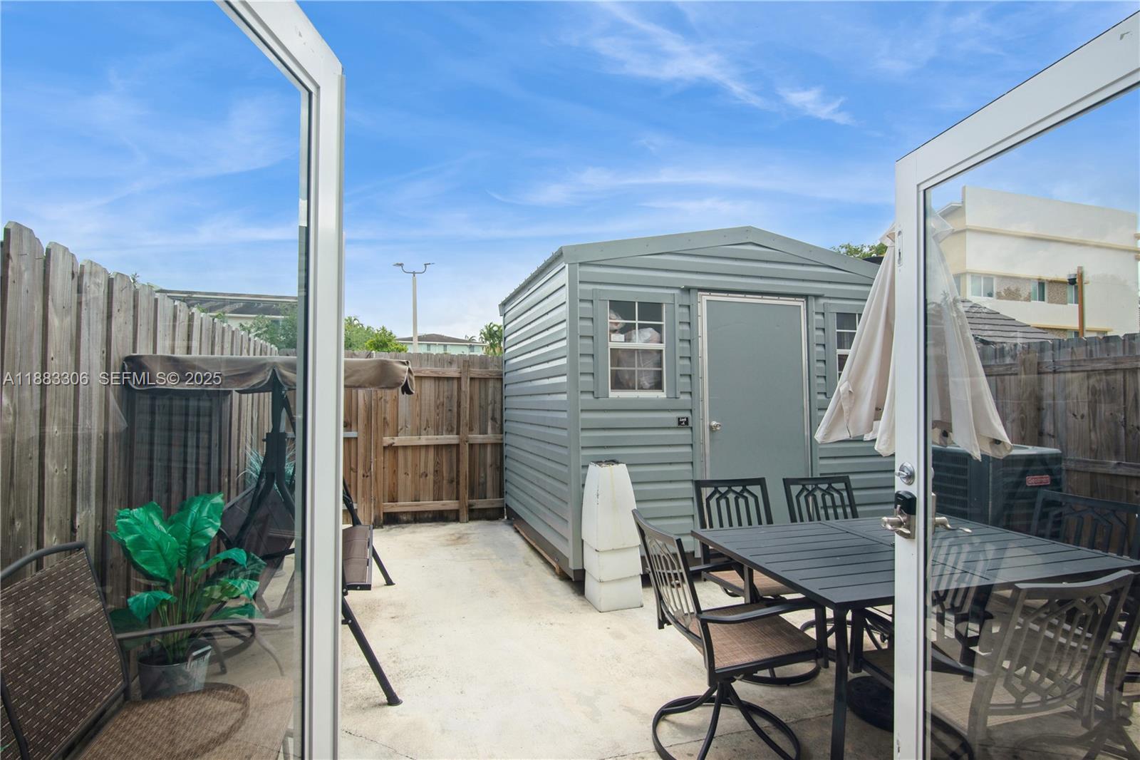 14366 Southwest 258th Lane Homestead, FL 33032 - Photo 24 of 24 a view of backyard with outdoor seating and plants