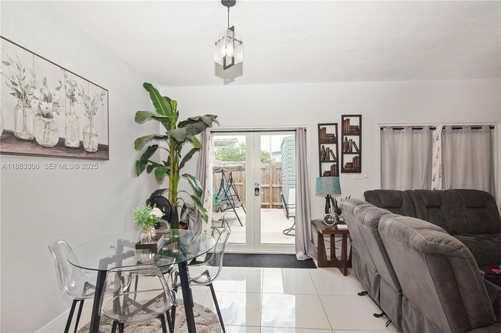 14366 Southwest 258th Lane Homestead, FL 33032 - Photo 9 of 24 a living room with furniture and a potted plant