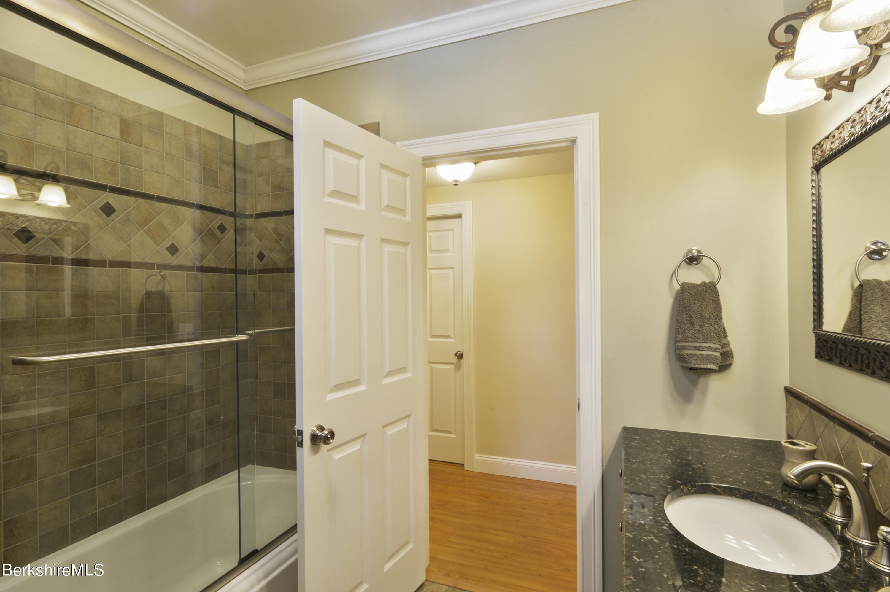 249 Woodmere Road Becket, MA 01223 - Photo 12 of 23 a bathroom with a sink and a mirror