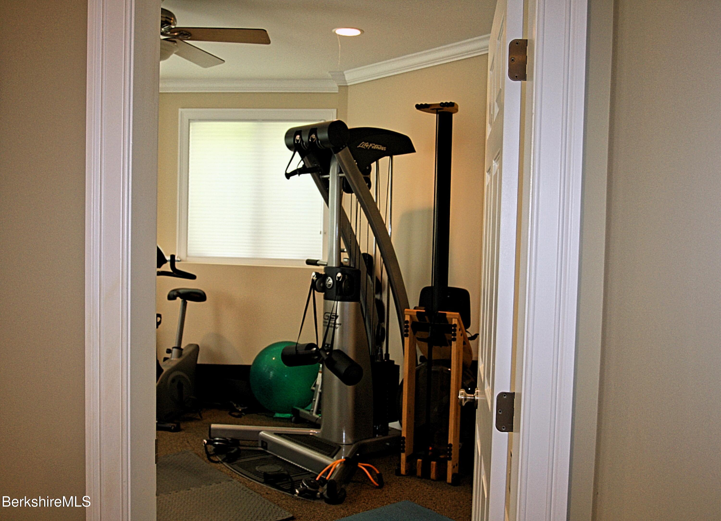 249 Woodmere Road Becket, MA 01223 - Photo 16 of 23 a view of a room with gym equipment