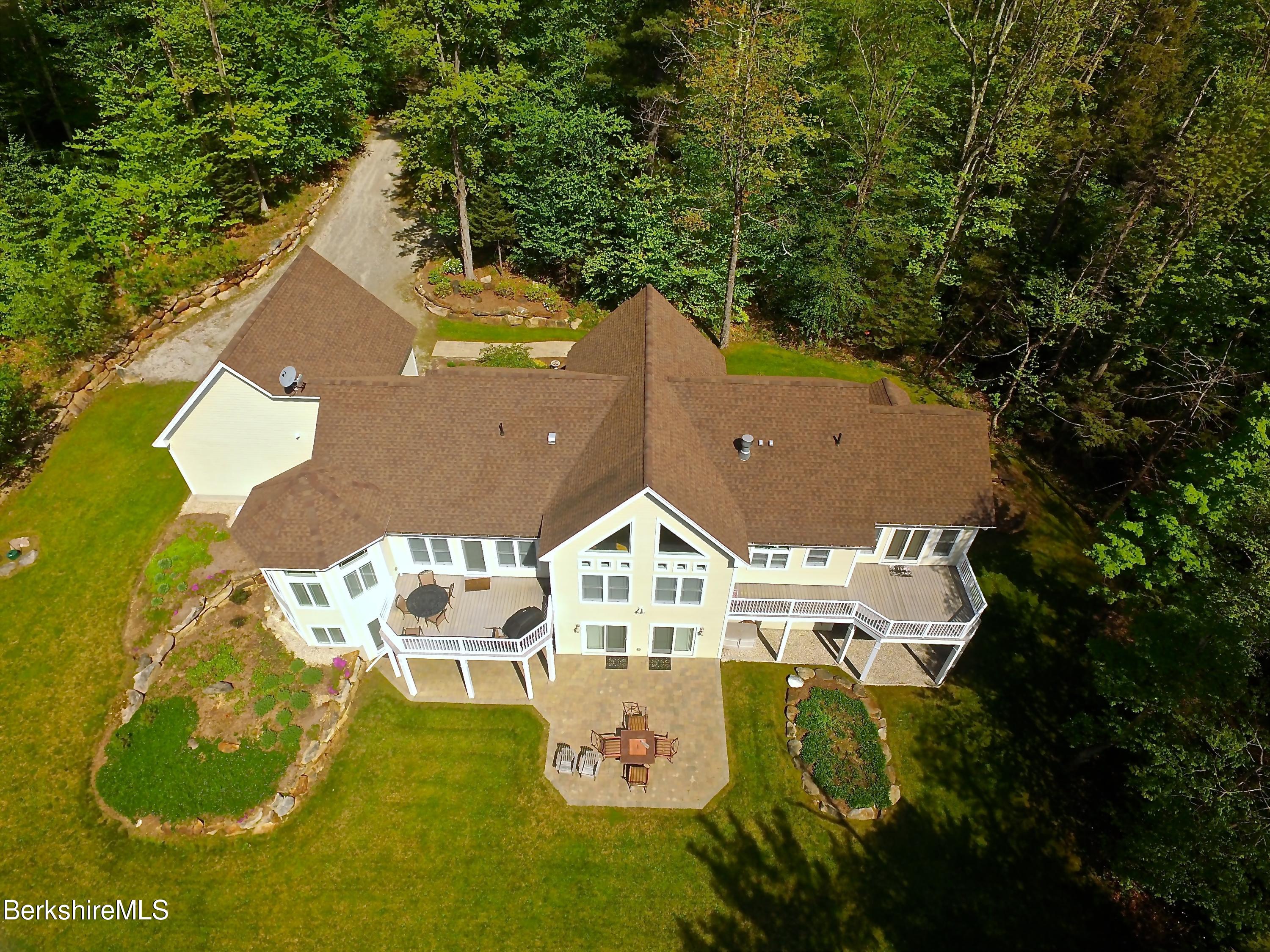 249 Woodmere Road Becket, MA 01223 - Photo 20 of 23 an aerial view of a house with swimming pool and big yard