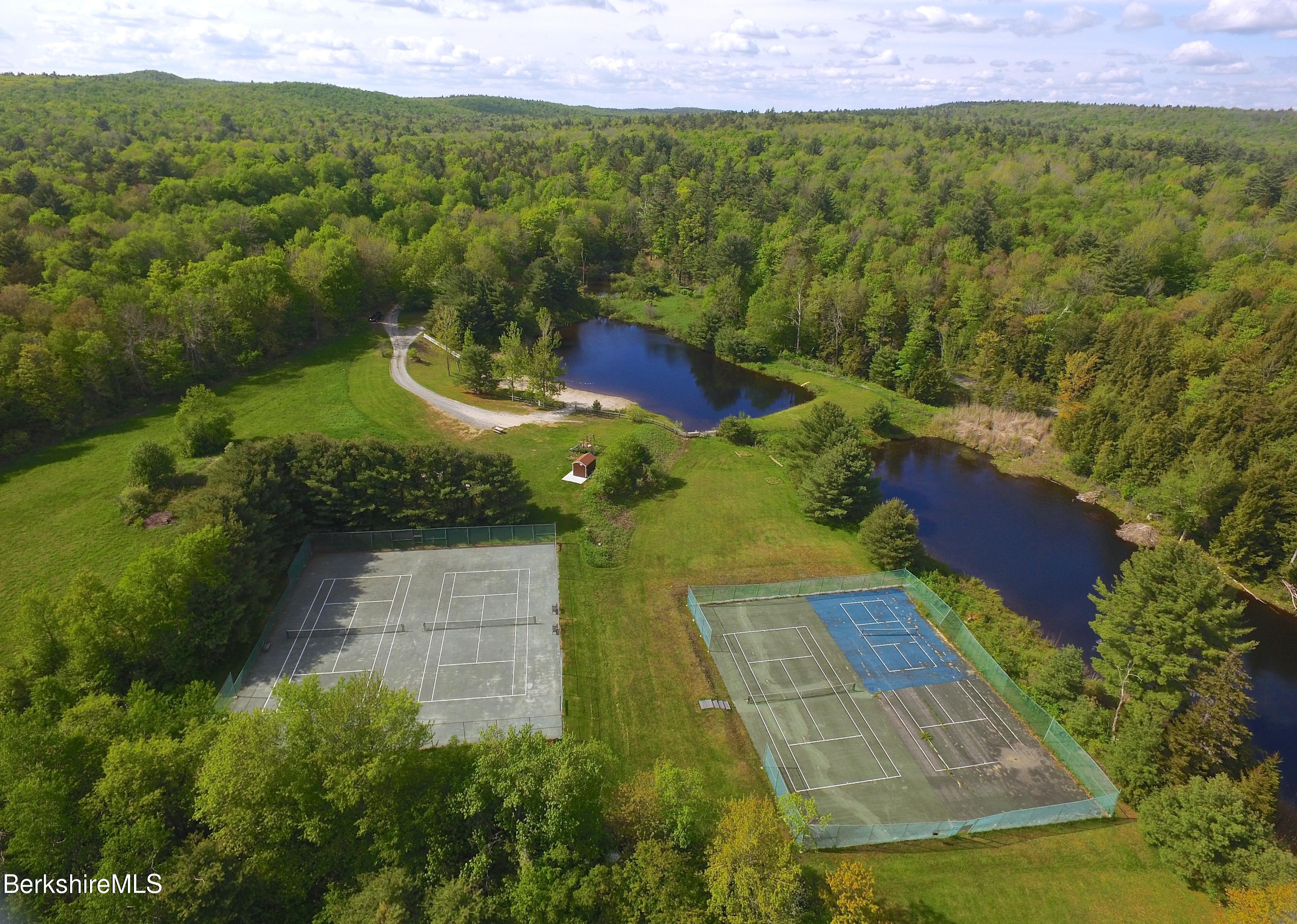 249 Woodmere Road Becket, MA 01223 - Photo 22 of 23 a view of an outdoor space and a yard