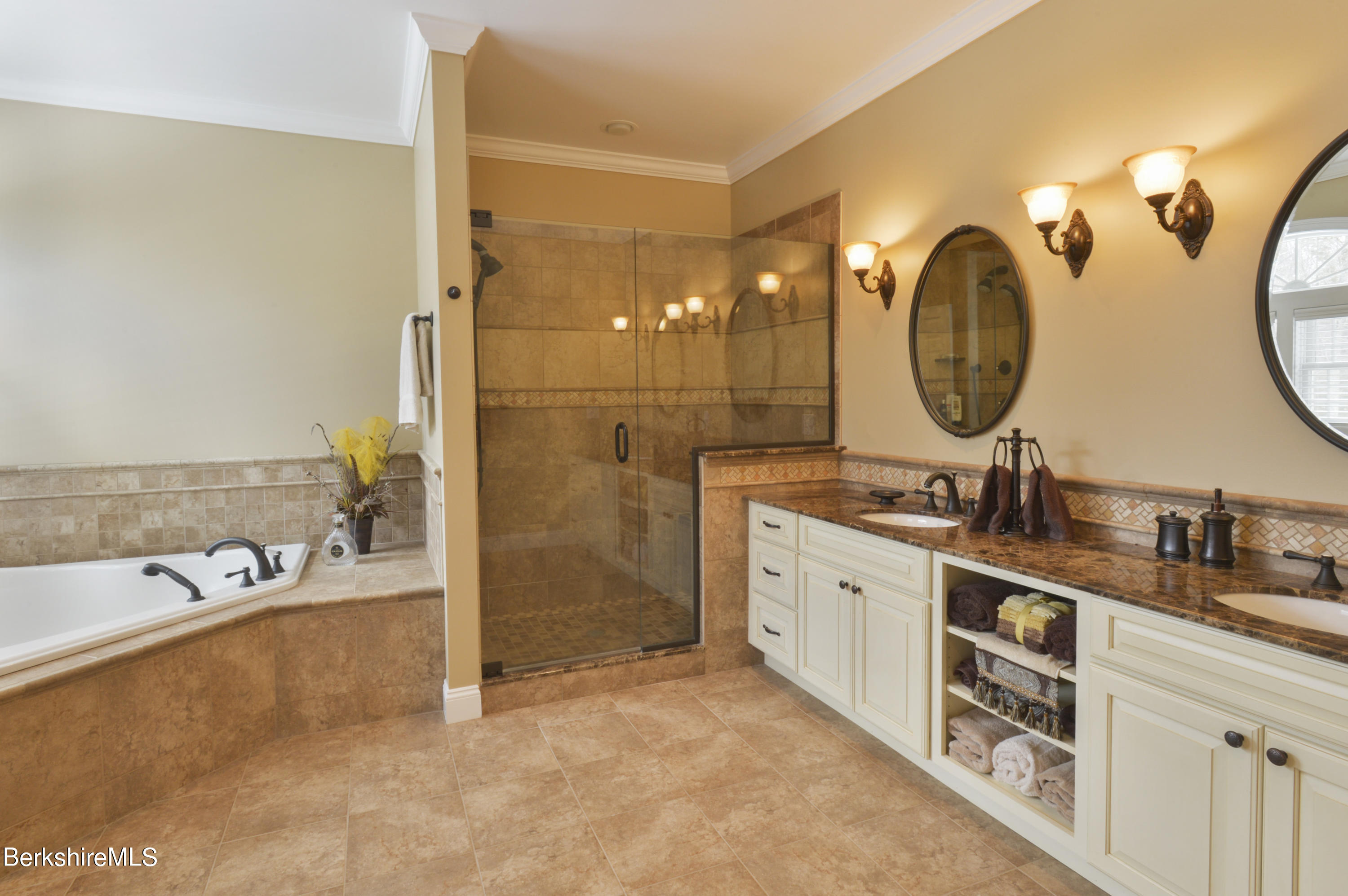 249 Woodmere Road Becket, MA 01223 - Photo 10 of 23 a spacious bathroom with a double vanity sink and a mirror