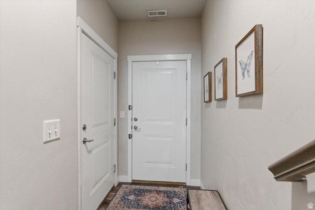 370 West Knights Lane Layton, UT 84041 - Photo 5 of 31 Entryway featuring a paneled door with white trim, wood-finish flooring, and light neutral wall paint