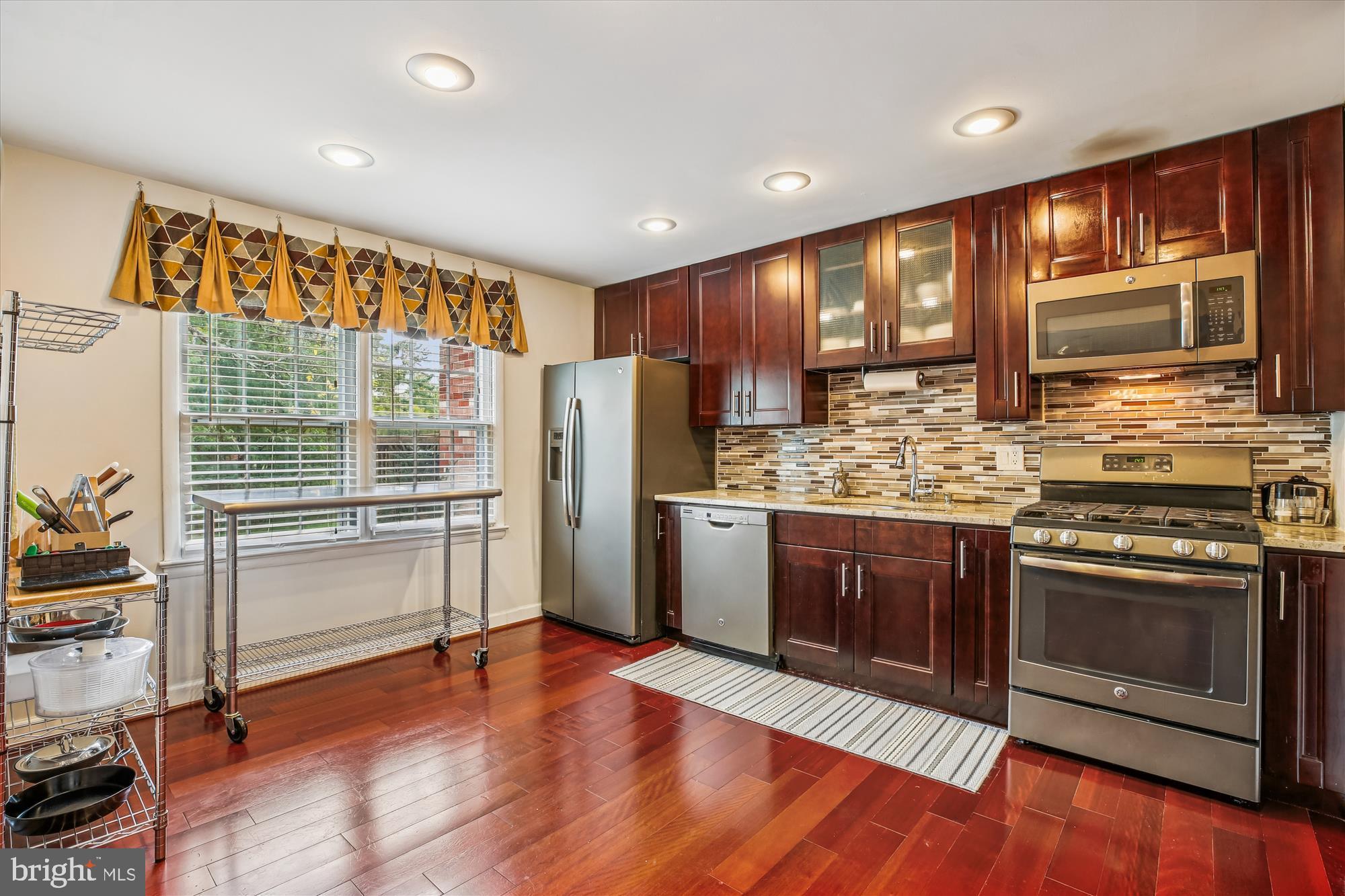 2702 Atlanta Drive, Unit 72702 Silver Spring, MD 20906 - Photo 13 of 55 a kitchen with stainless steel appliances granite countertop a refrigerator stove and sink