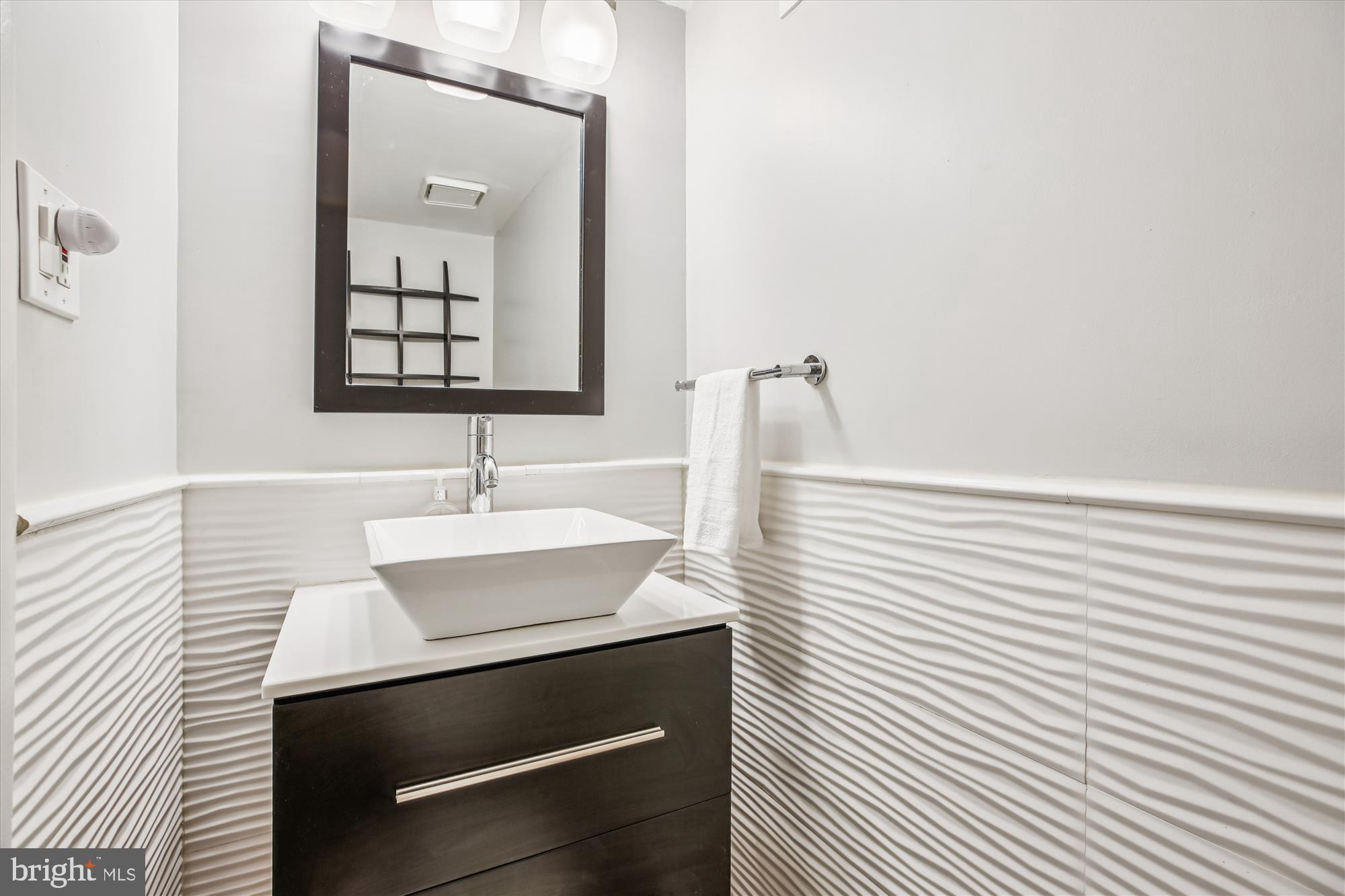 2702 Atlanta Drive, Unit 72702 Silver Spring, MD 20906 - Photo 17 of 55 a bathroom with a sink and a mirror