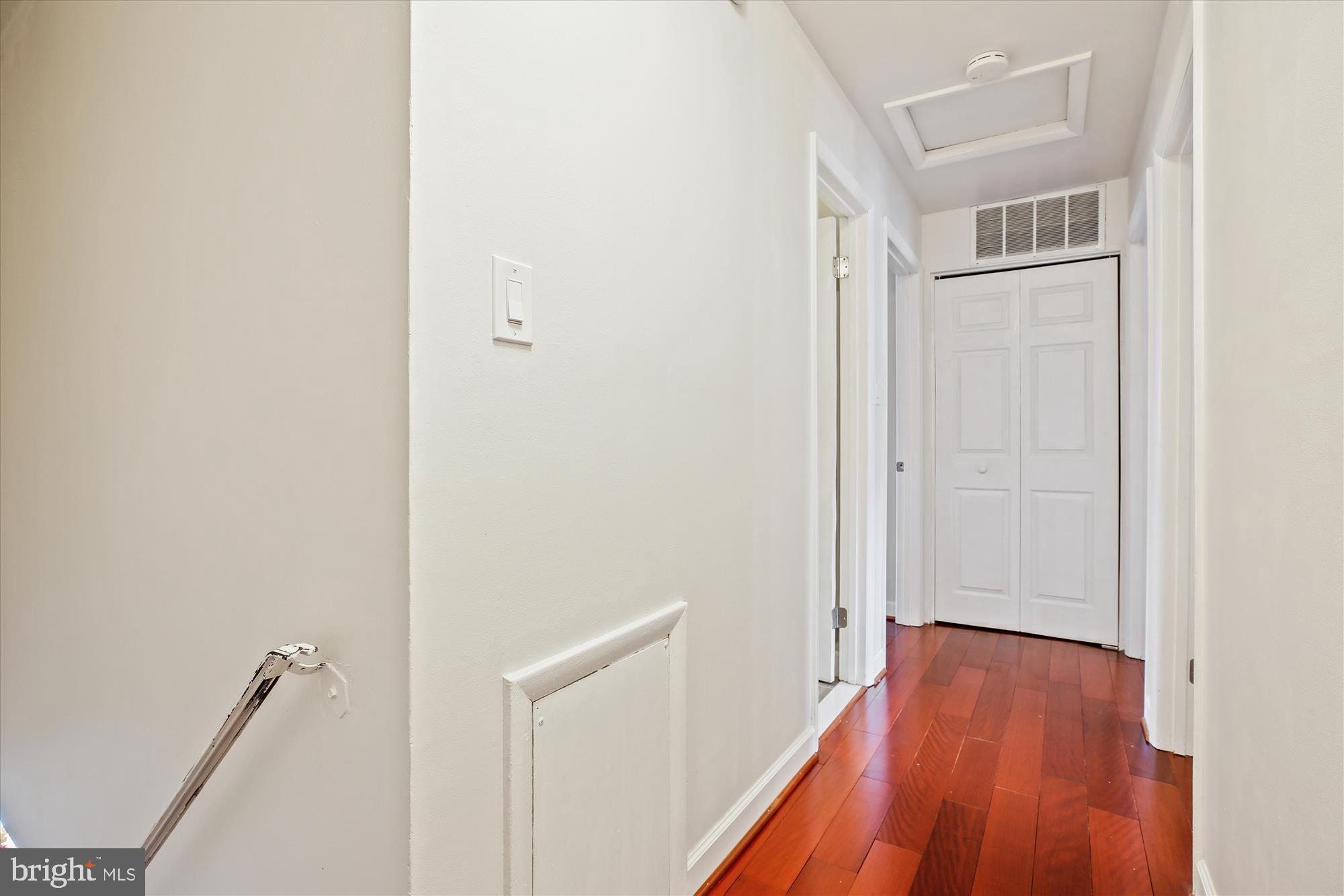 2702 Atlanta Drive, Unit 72702 Silver Spring, MD 20906 - Photo 20 of 55 a view of a room with wooden floor and a hallway
