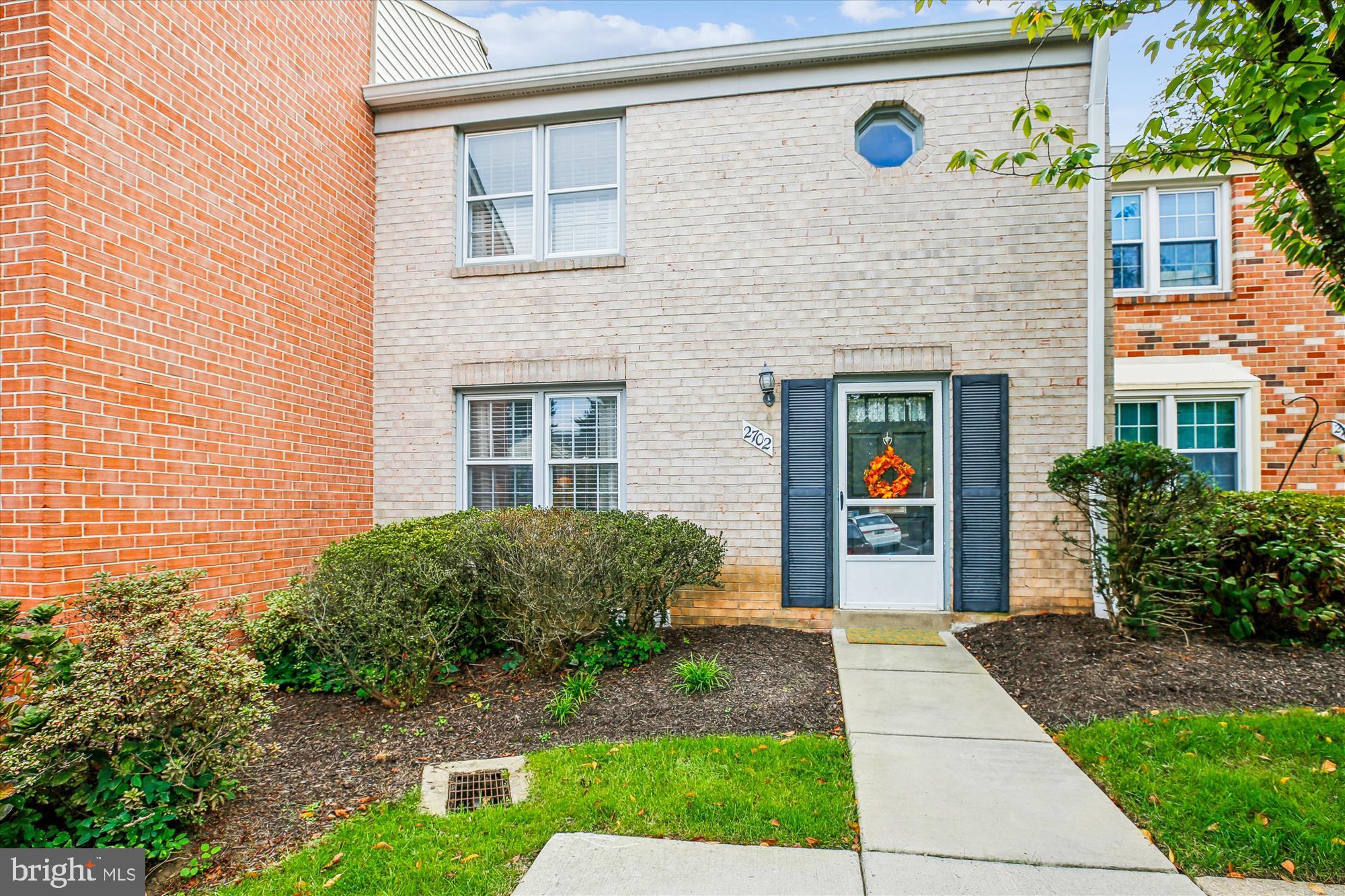 2702 Atlanta Drive, Unit 72702 Silver Spring, MD 20906 - Photo 2 of 55 a front view of a house with garden